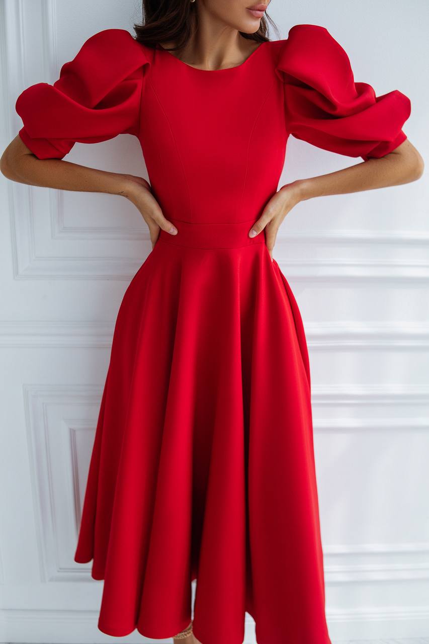 Red dress with puffed sleeves on a white background
