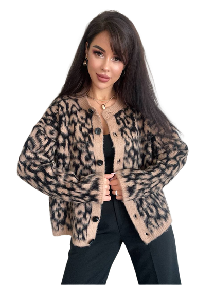 Woman wearing a leopard print cardigan on a white background