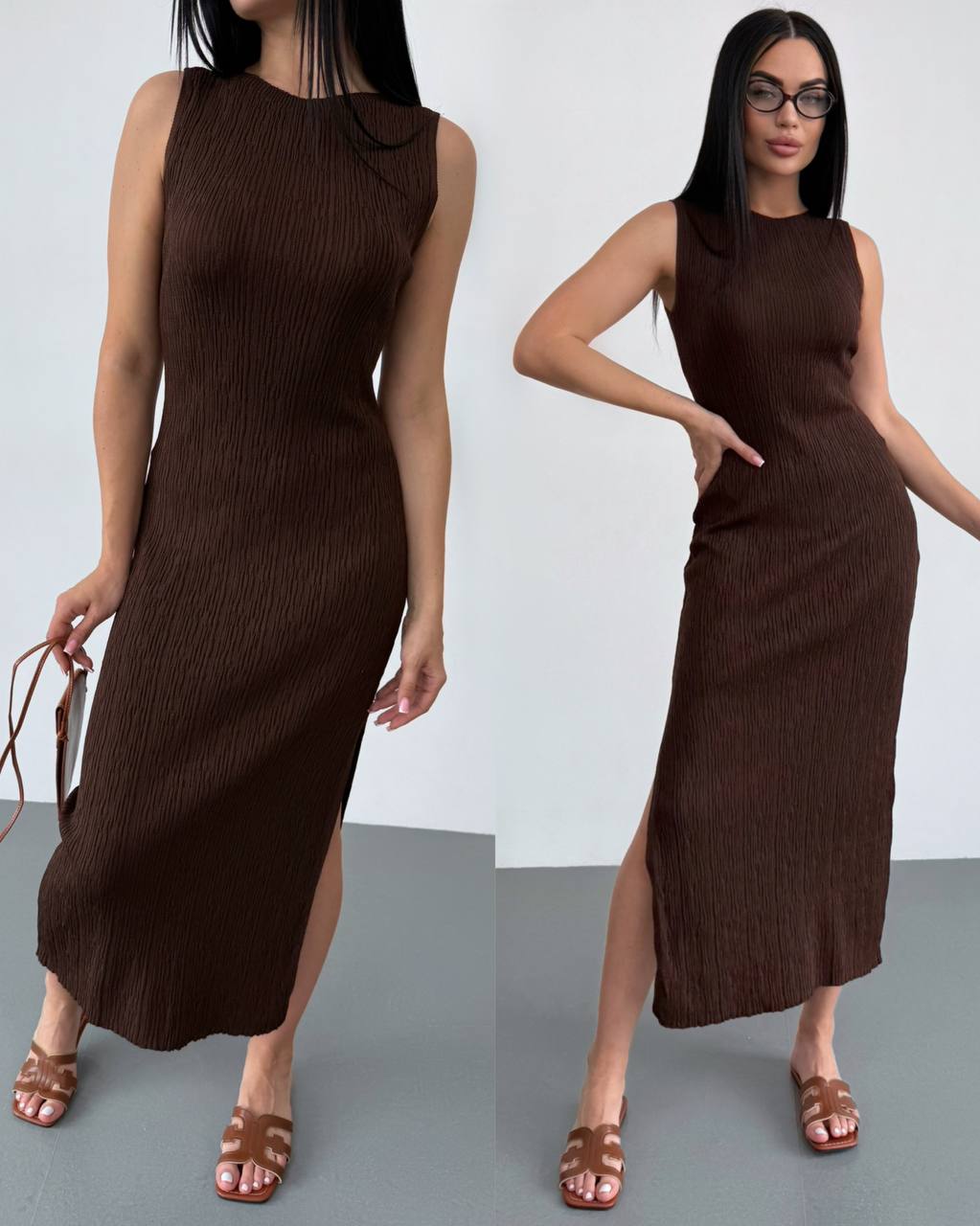 Woman wearing a brown sleeveless dress with a slit on a plain background