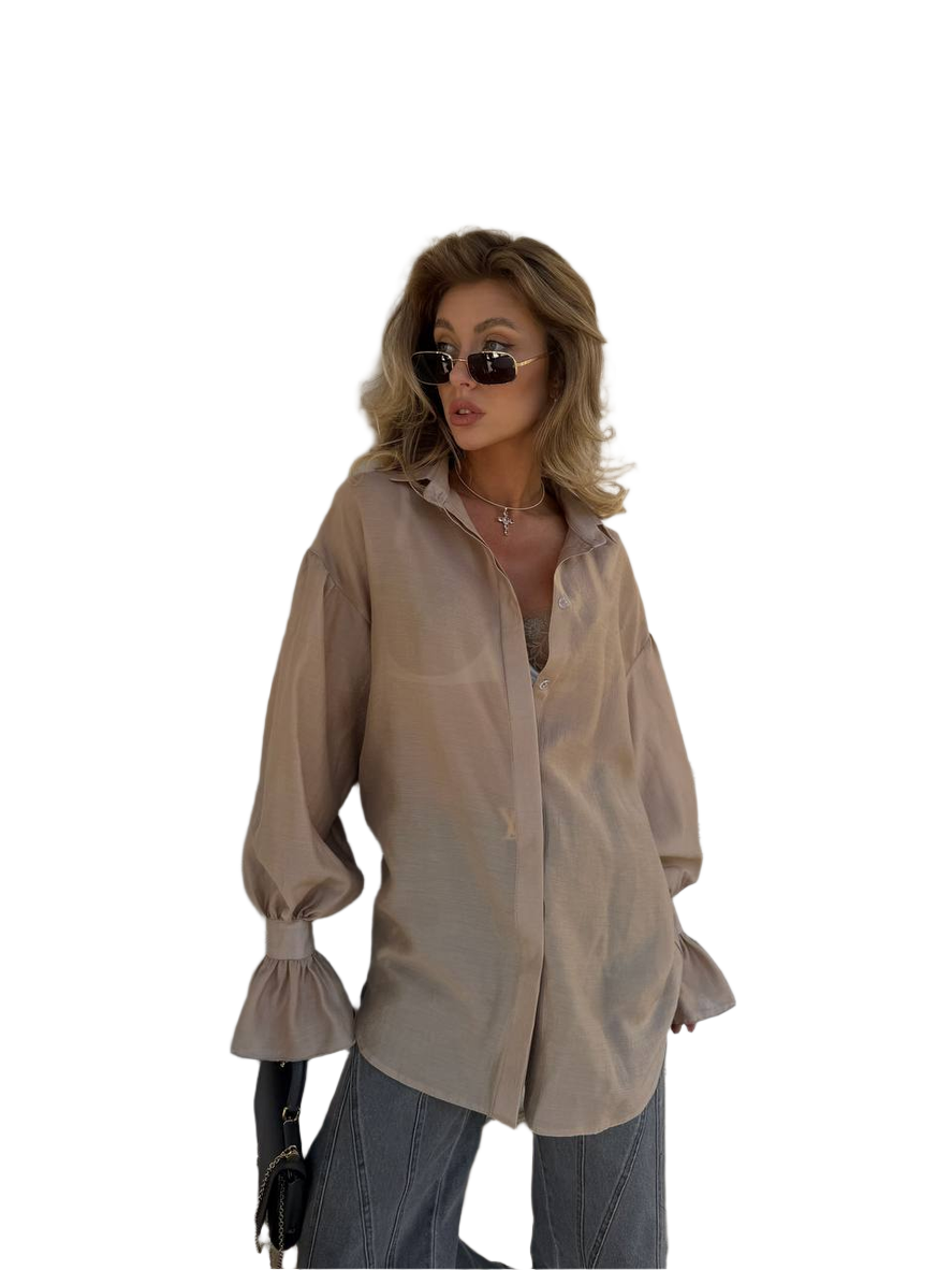 Woman wearing a beige blouse and sunglasses on a white background