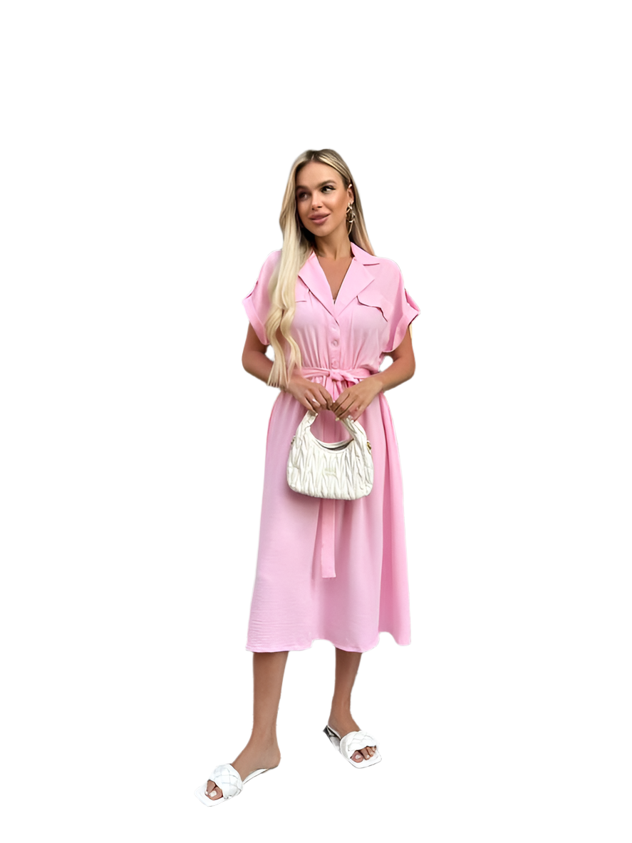 Woman wearing a pink dress holding a white handbag on a white background