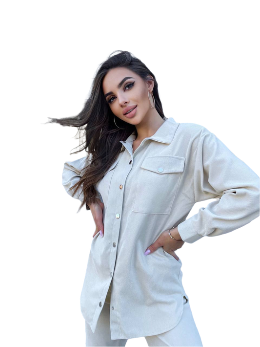 Woman wearing a light-colored denim shirt on a white background