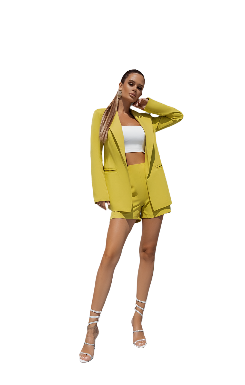 Woman wearing a bright yellow suit with a white top on a white background