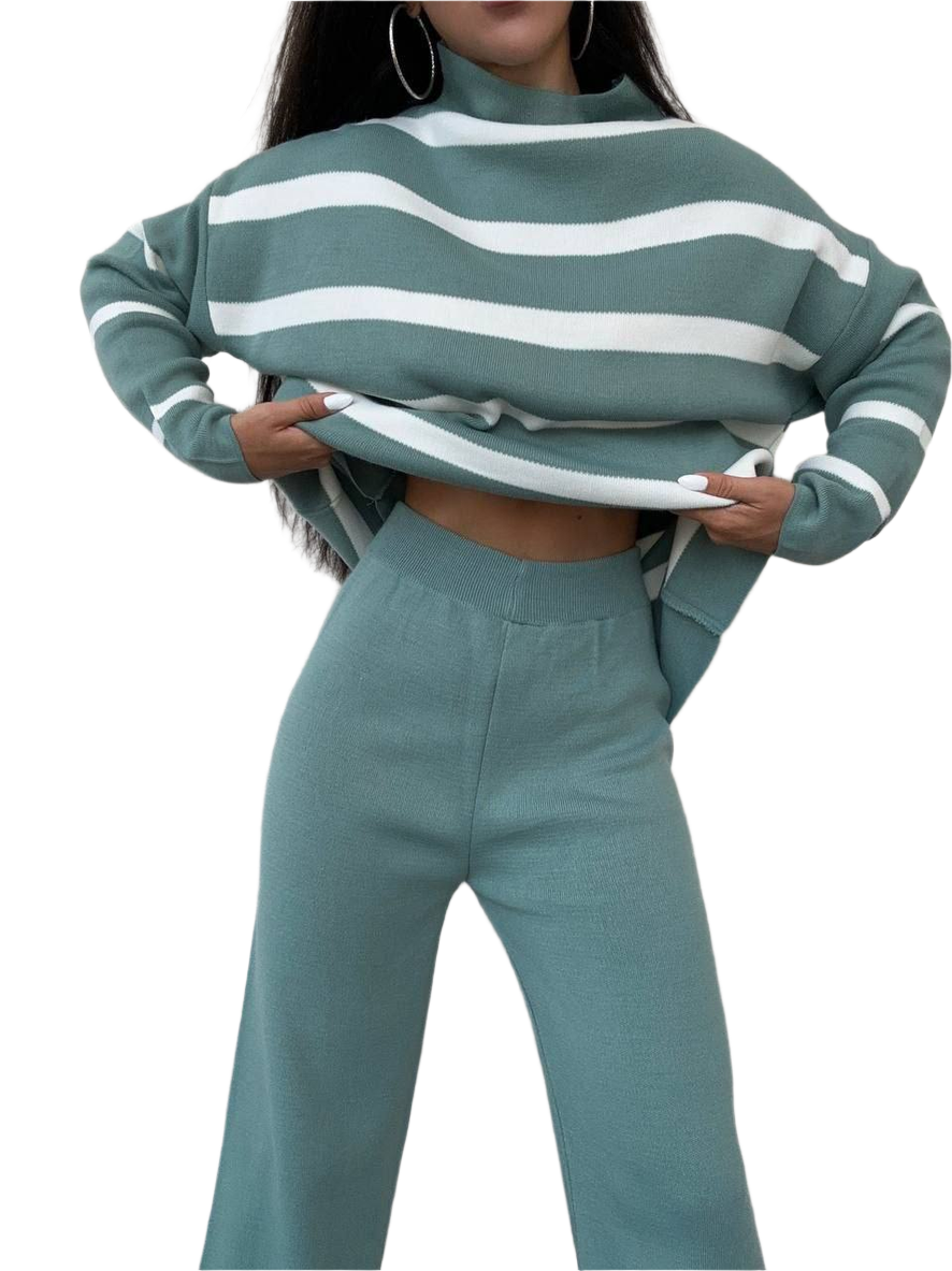 Person wearing a green and white striped sweater and matching pants on a white background