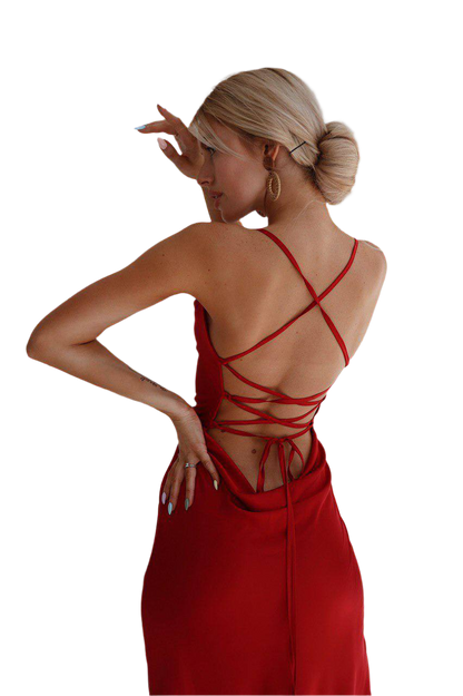 Woman wearing a red dress with a strappy back design on a white background