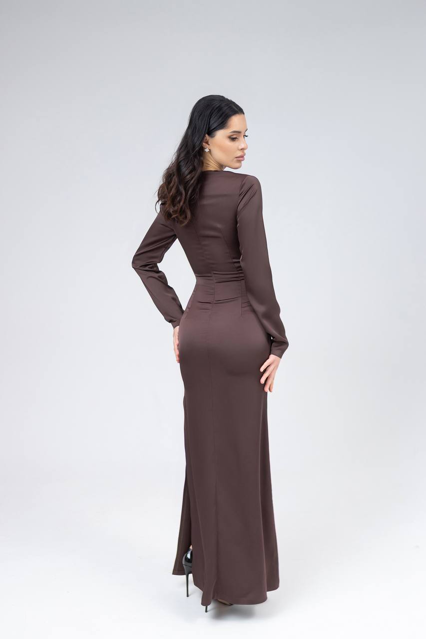 Woman wearing a brown dress on a white background