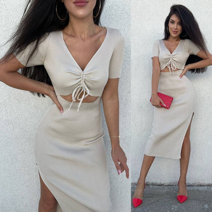 Two women wearing matching outfits with a white background