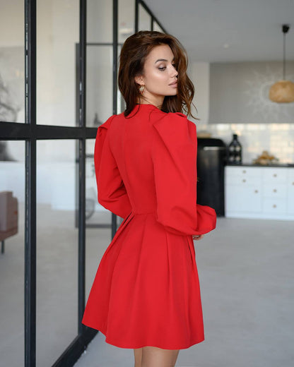 Woman wearing a red dress in a modern kitchen setting