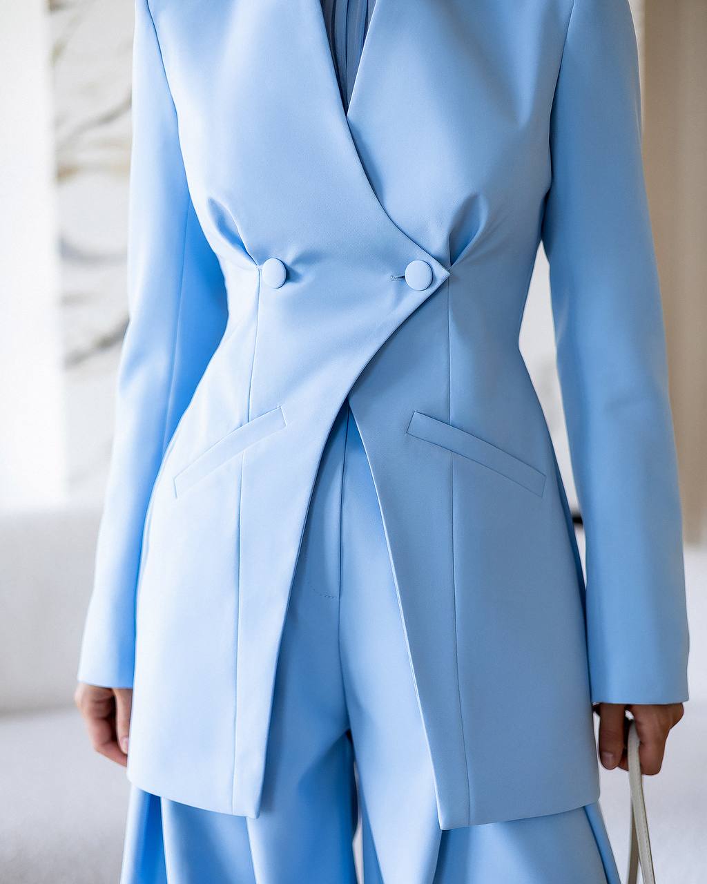 Light blue coat with a blurred background