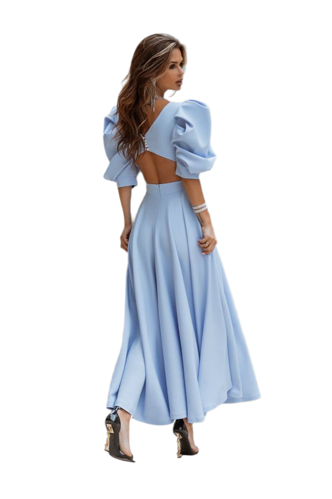 Woman wearing a light blue dress with puffed sleeves on a white background