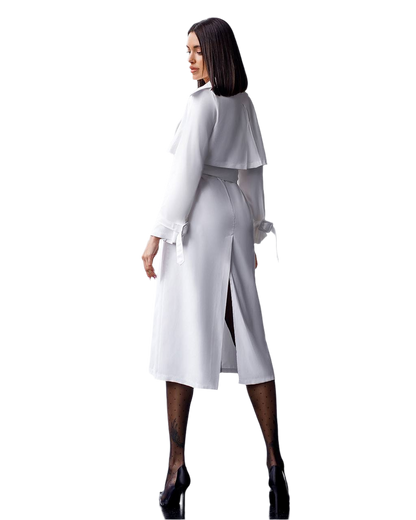 Woman wearing a white dress with a belt on a white background