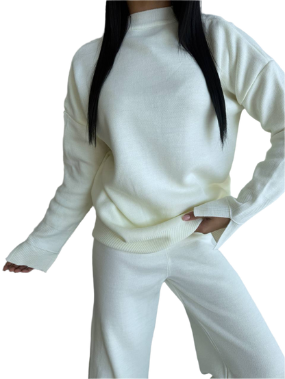 White sweater and pants set on a white background