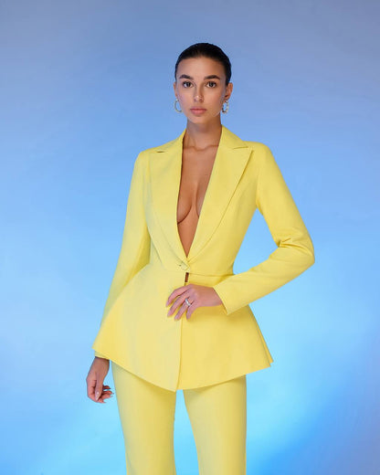 Person wearing a bright yellow suit against a blue gradient background