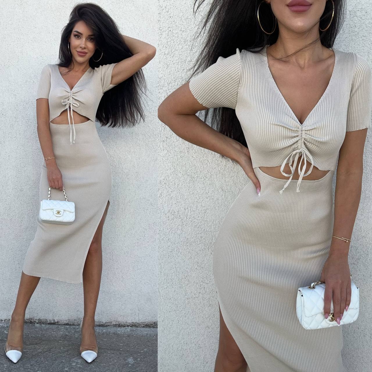 Woman wearing a beige dress with a cut-out design, posing against a white wall.