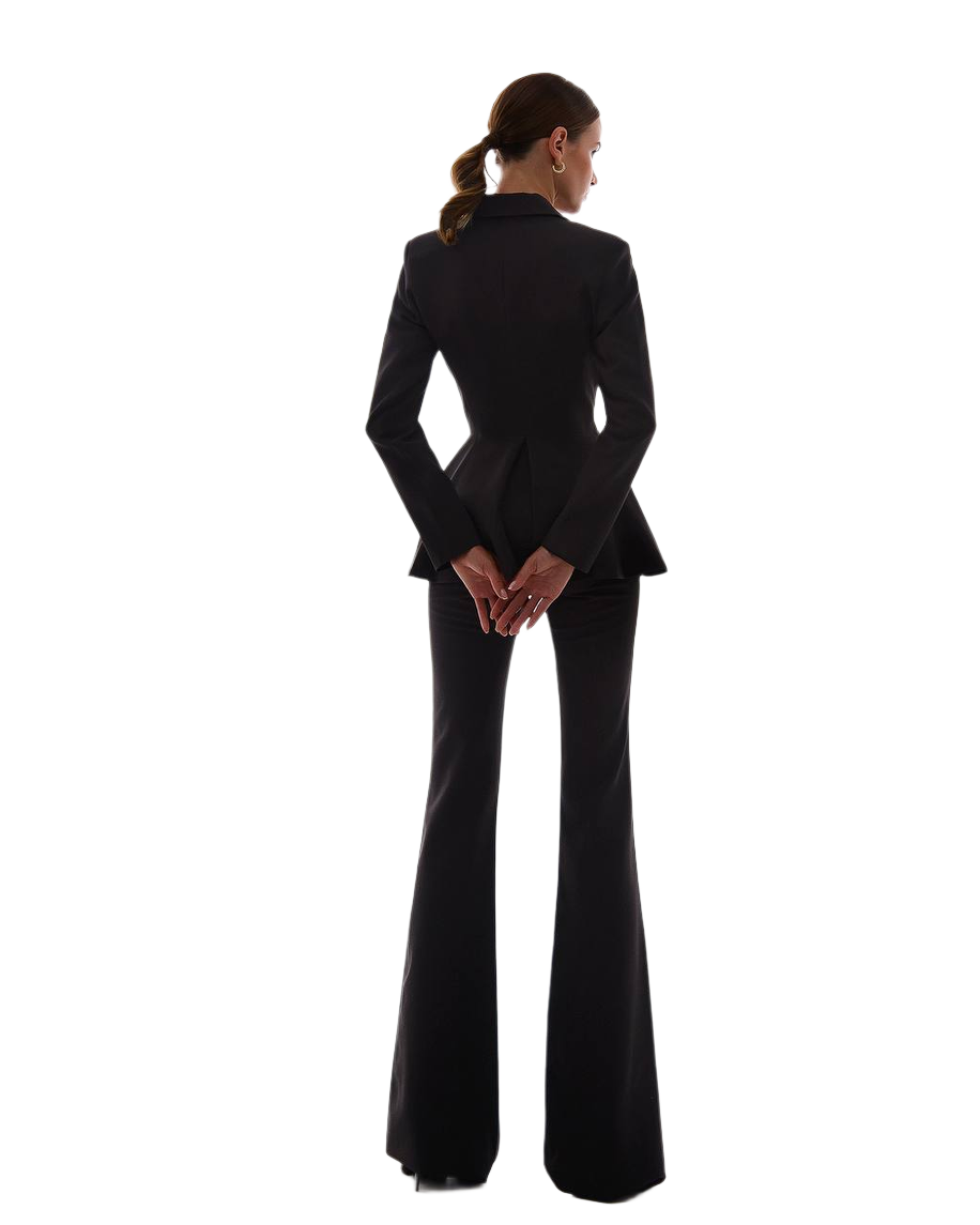 Person wearing a black suit on a white background