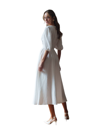 Woman wearing a white dress on a white background