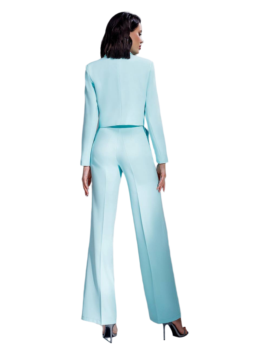 Woman wearing a light blue suit on a white background
