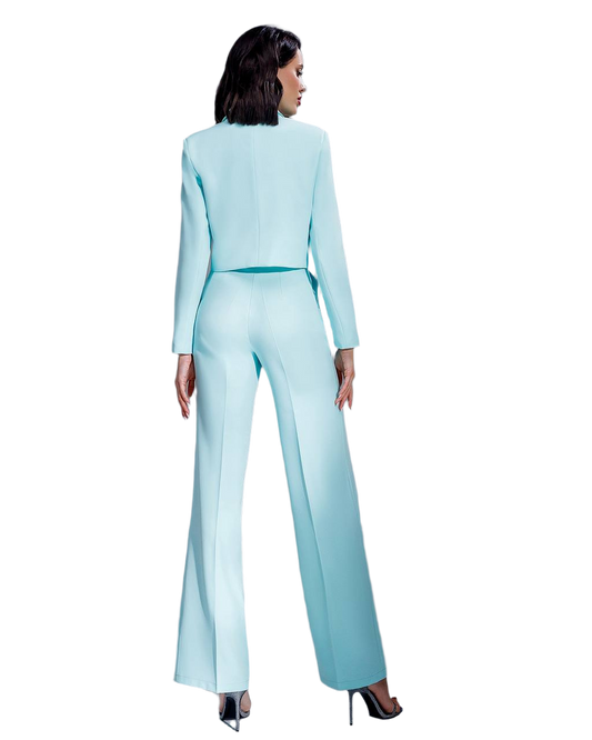 Woman wearing a light blue suit on a white background
