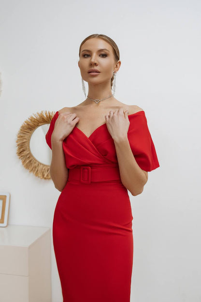 Woman wearing a red off-shoulder dress with a white background