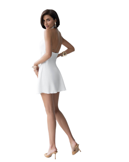 Woman wearing a white dress on a white background