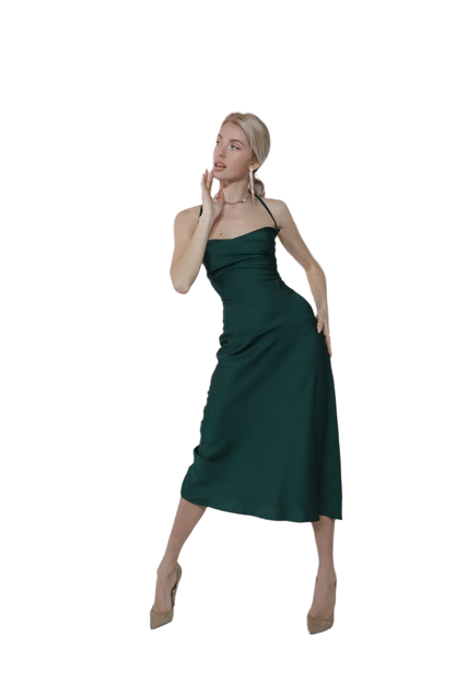 Woman wearing a green dress on a white background