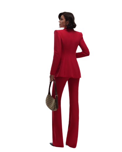 Woman wearing a red suit with a white background