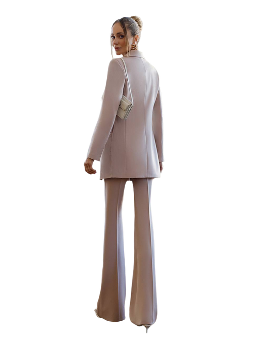 Woman wearing a beige suit with a white background