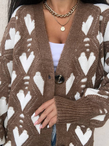 Brown cardigan with white heart pattern worn by a person