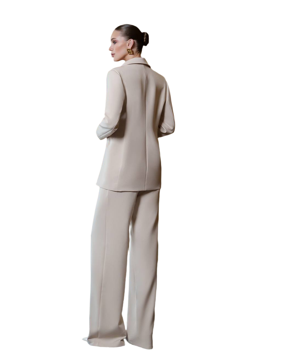 Woman wearing a beige suit on a white background