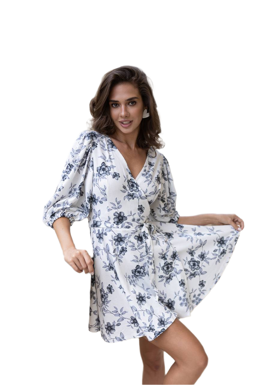 Woman wearing a white floral dress on a white background