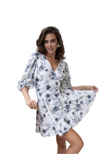 Woman wearing a white floral dress on a white background