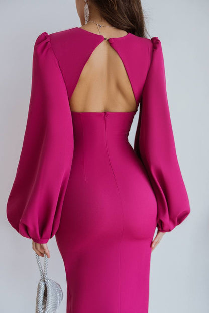 Pink dress with open back and long sleeves on a white background