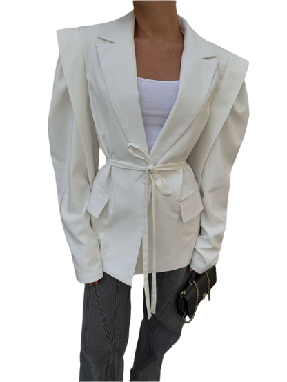 White blazer with a belt tied around the waist on a white background
