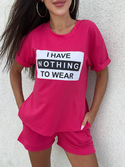 Person wearing a pink outfit with a shirt and shorts set, featuring a humorous text design.