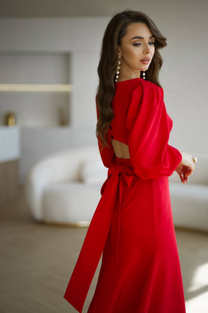 Woman wearing a red dress in an indoor setting
