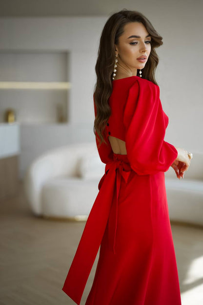 Woman wearing a red dress in an indoor setting