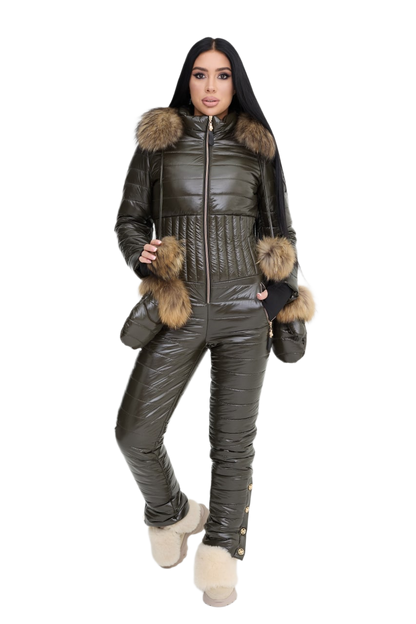 Woman wearing a dark green puffer jumpsuit with fur trim on a white background