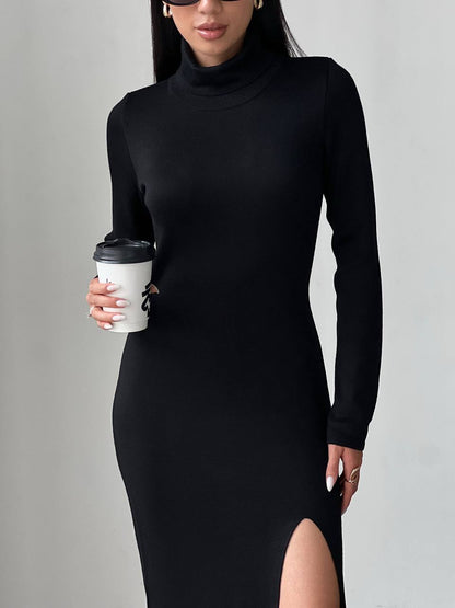 Person wearing a black dress holding a coffee cup against a gray background