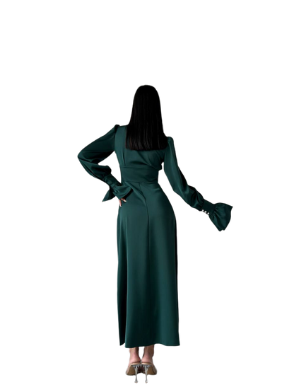 Green dress worn by a person on a white background