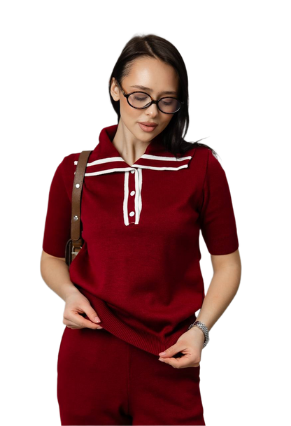 Woman wearing a red outfit with white accents on a white background