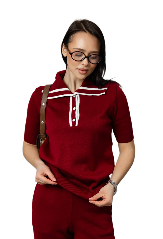 Woman wearing a red outfit with white accents on a white background