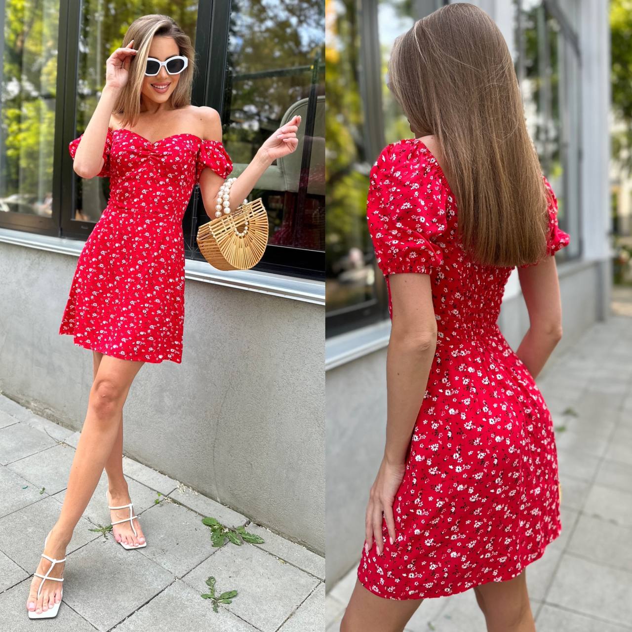 Woman wearing a red floral dress in an urban setting