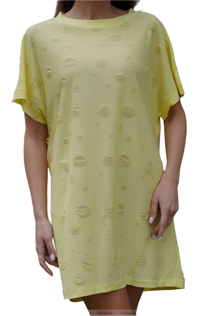Yellow dress with textured pattern worn by a person on a white background