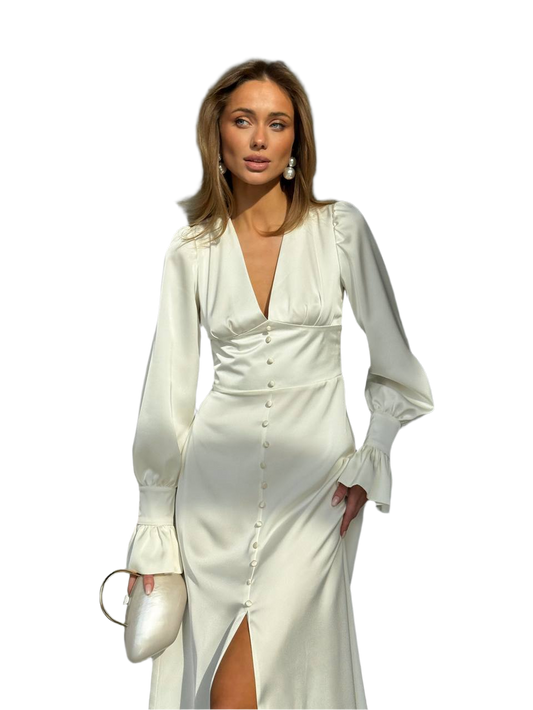 Woman wearing a white dress with long sleeves on a white background