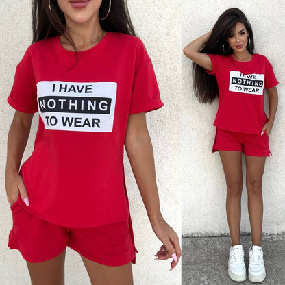 Woman wearing a red outfit with a humorous text shirt against a plain background