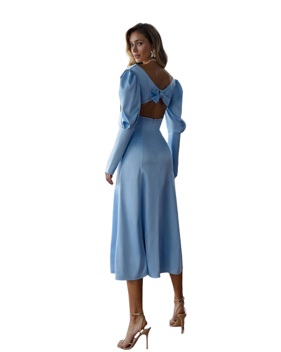 Woman wearing a light blue dress with long sleeves on a white background
