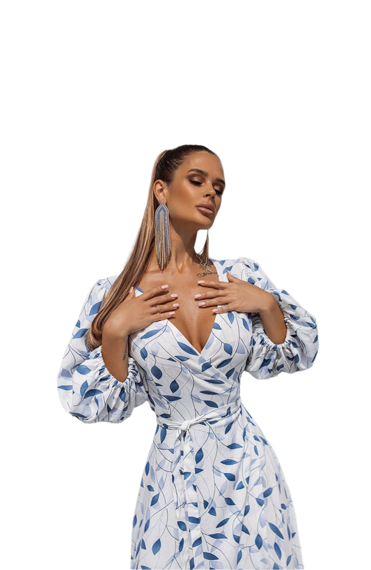 Woman wearing a blue and white patterned dress on a white background