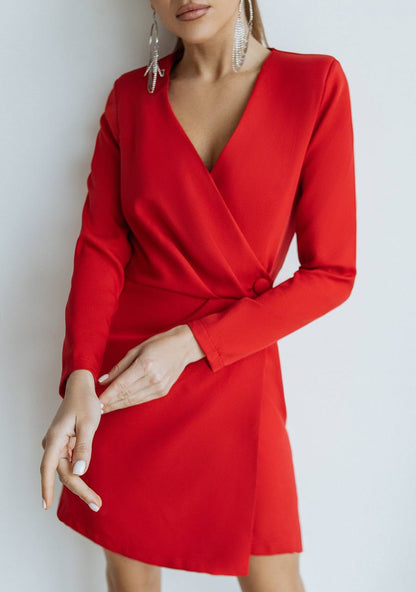 Red dress worn by a person against a plain background