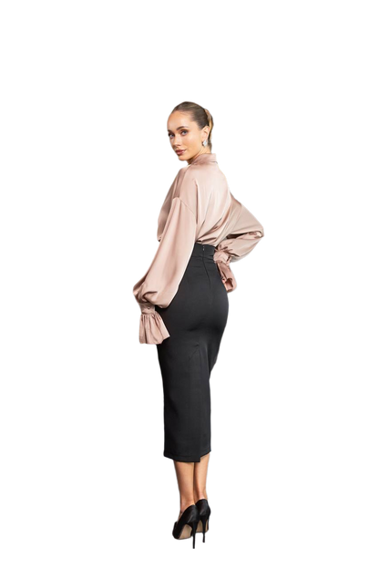 Woman wearing a beige blouse and black pencil skirt on a white background