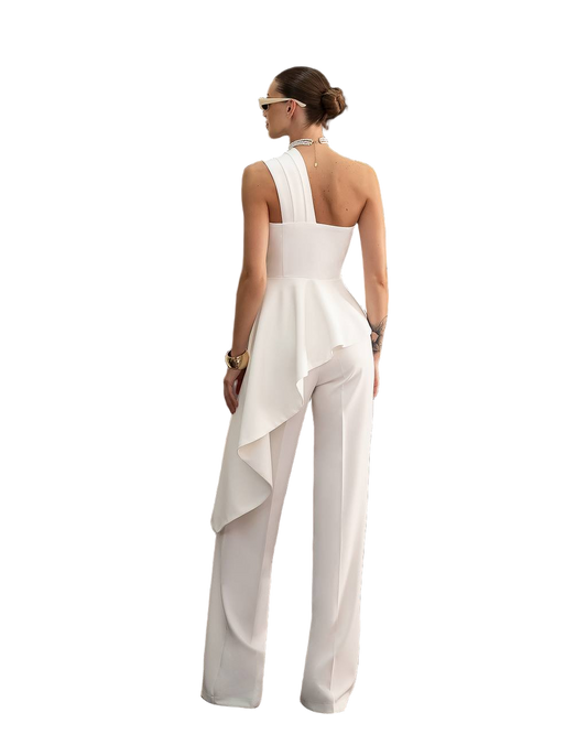 Woman wearing a white one-shoulder jumpsuit on a white background